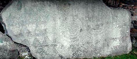 Swirls and lozenge shapes on a rock