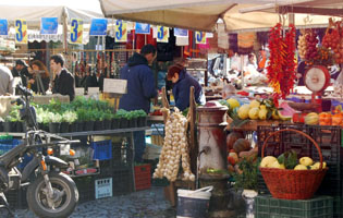 Vendors with fruits and veggies at the Campo di Fiori