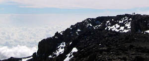 two people walking to the summit